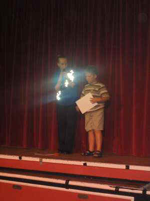 Friends little boy collecting certificate from debs